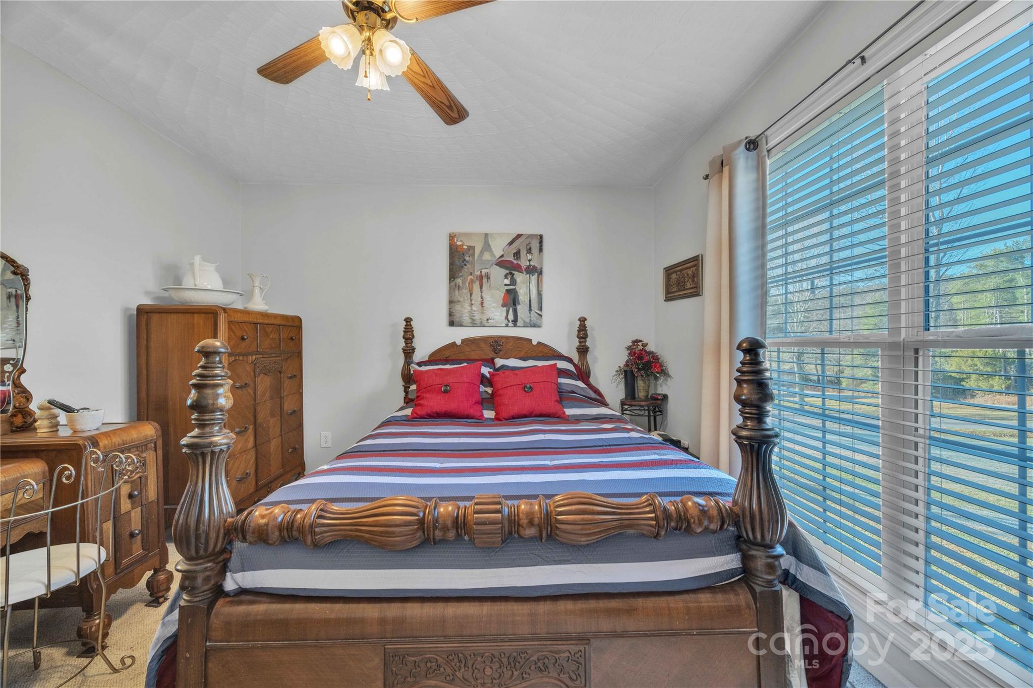 57 Riverview Road Taylorsville, NC 28681 - Photo 25 of 30 a bedroom with furniture and a chandelier