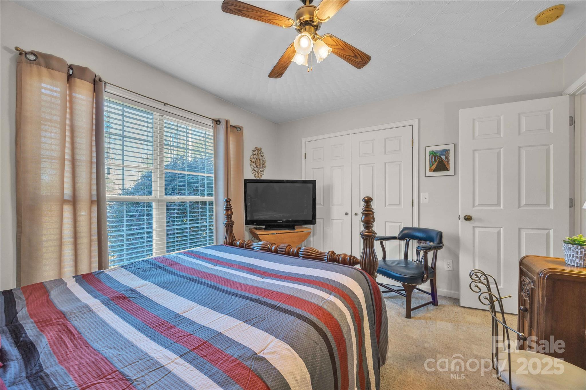 57 Riverview Road Taylorsville, NC 28681 - Photo 26 of 30 a bedroom with a bed and a flat screen tv