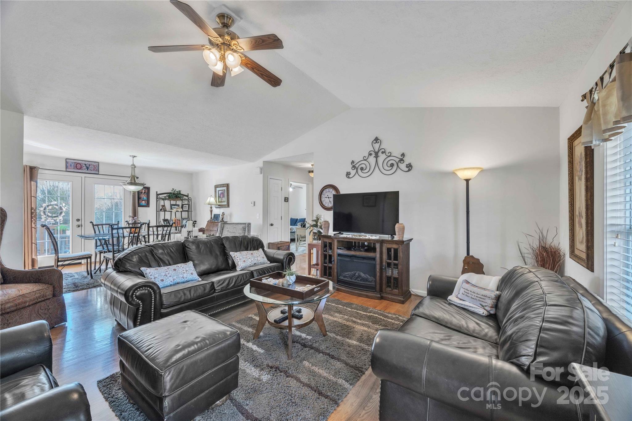57 Riverview Road Taylorsville, NC 28681 - Photo 8 of 30 a living room with furniture a flat screen tv and kitchen view