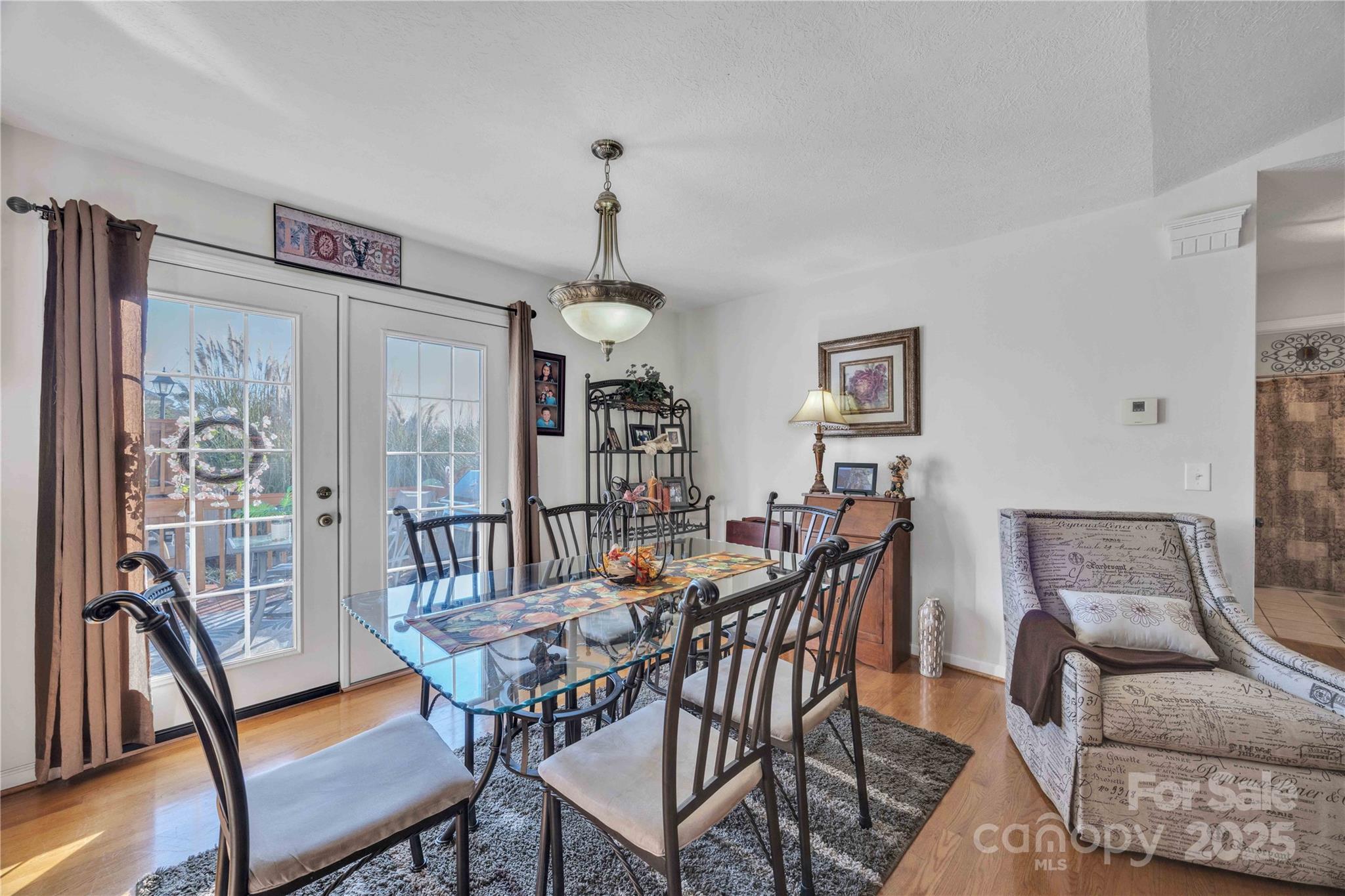 57 Riverview Road Taylorsville, NC 28681 - Photo 10 of 30 a view of a dining room with furniture window and wooden floor