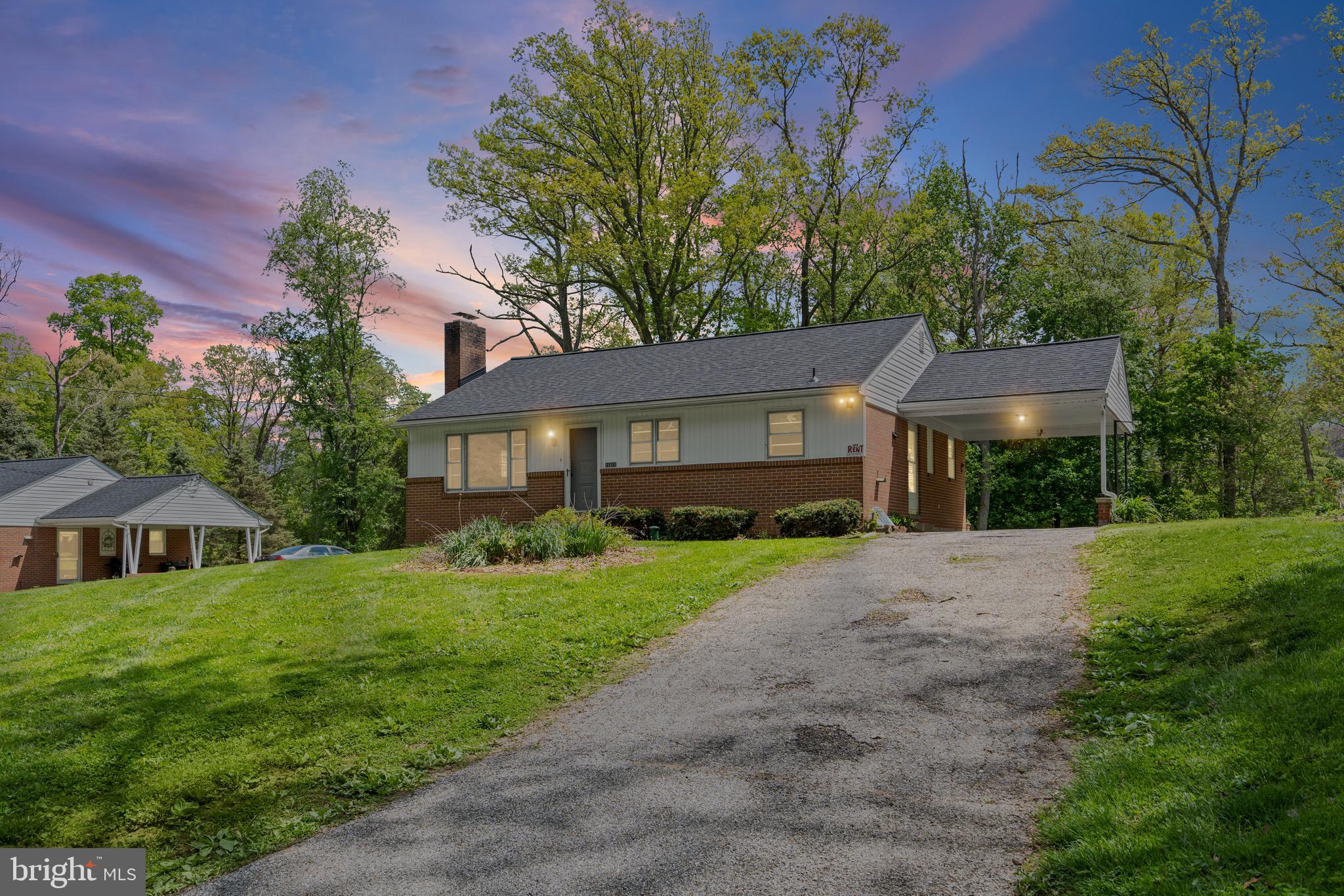 16811 Ridge Road Upperco, MD 21155 - Photo 1 of 22 a front view of a house with a yard and garage
