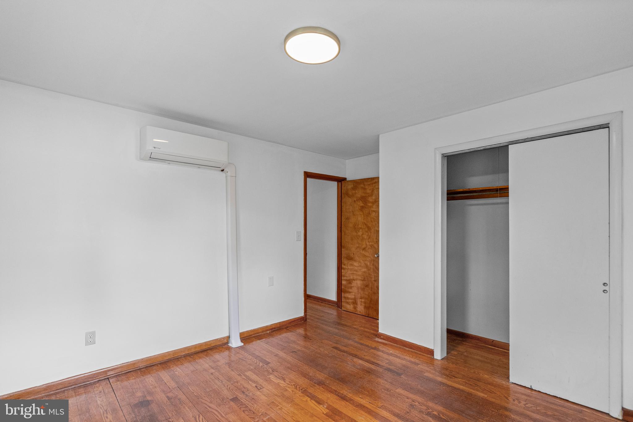 16811 Ridge Road Upperco, MD 21155 - Photo 16 of 22 a view of an empty room with wooden floor and closet