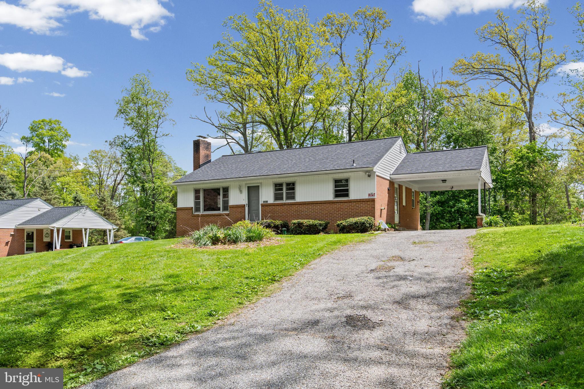 16811 Ridge Road Upperco, MD 21155 - Photo 2 of 22 a front view of a house with garden
