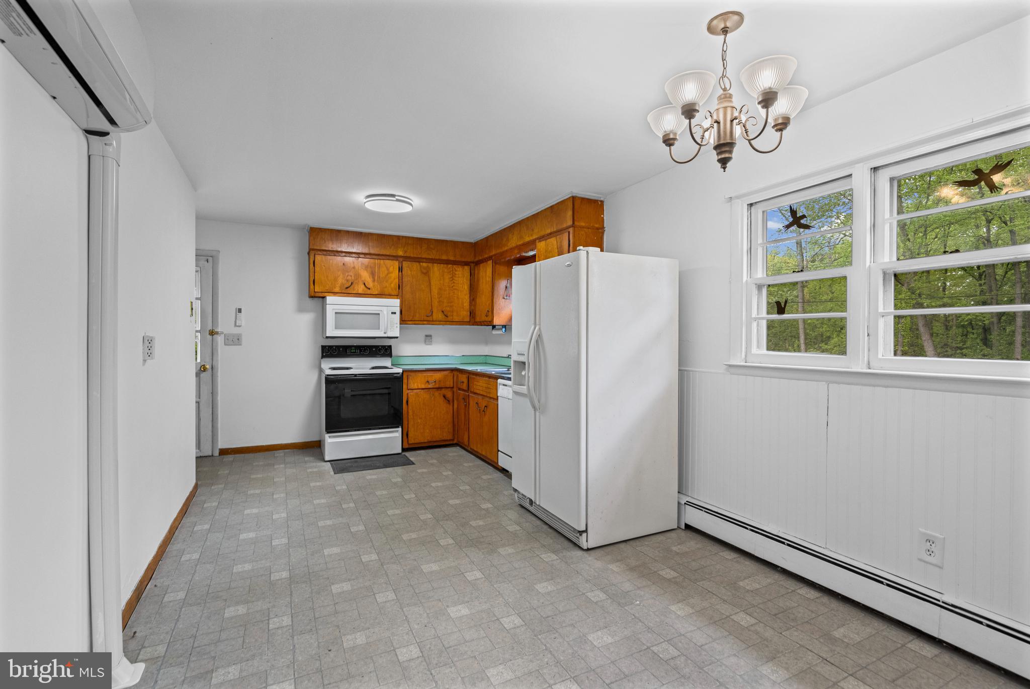 16811 Ridge Road Upperco, MD 21155 - Photo 8 of 22 a view of kitchen with refrigerator cabinets and window