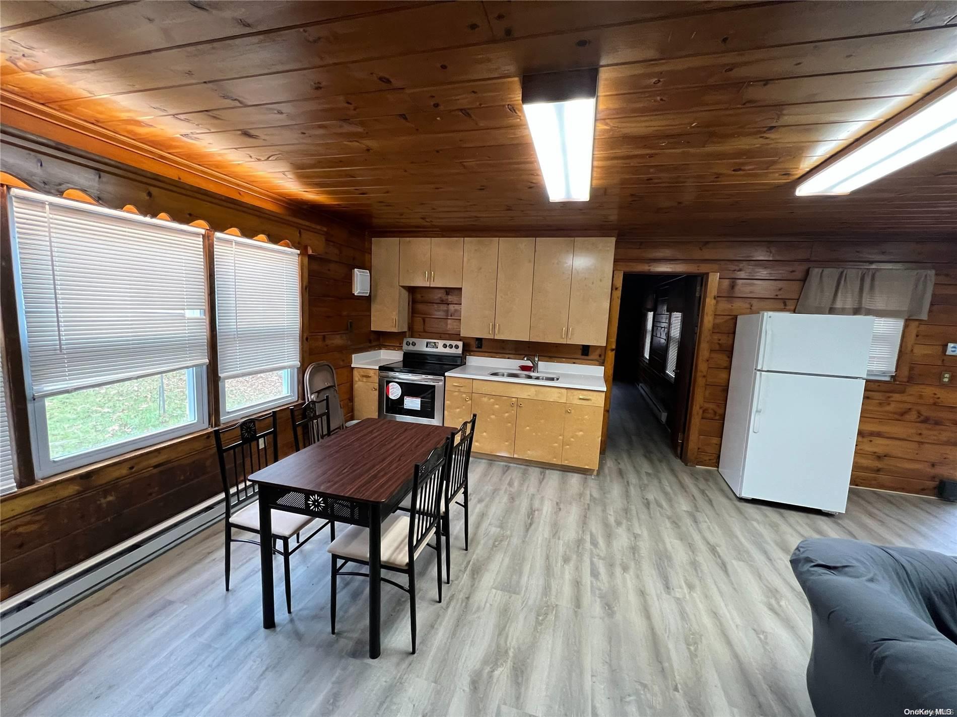 127 Kirkwood Road Stroudsburg, PA 18360 - Photo 12 of 20 a view of a dining room with furniture window and wooden floor