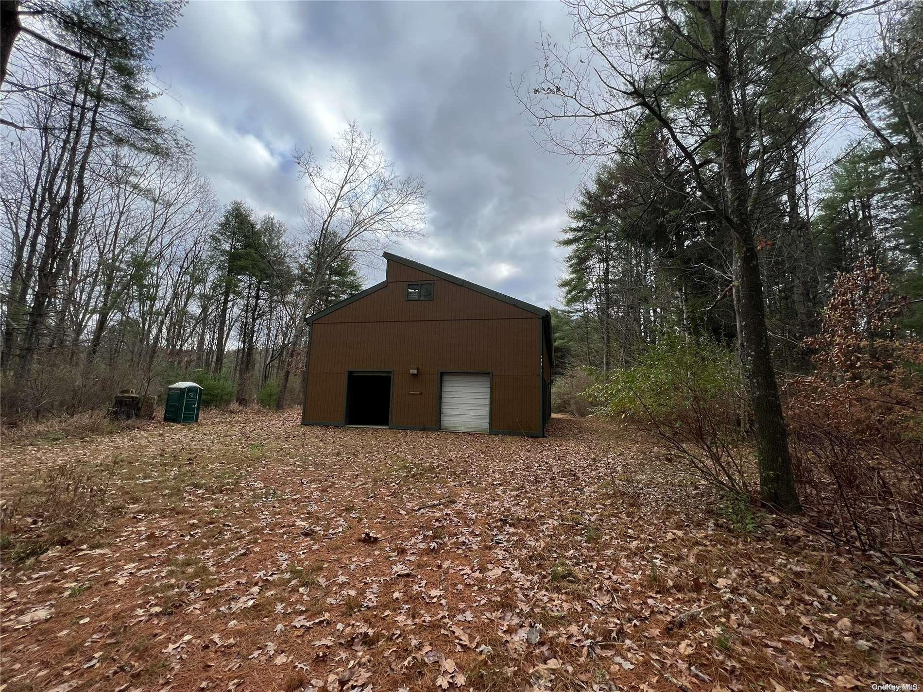 127 Kirkwood Road Stroudsburg, PA 18360 - Photo 18 of 20 a house with trees in front of it