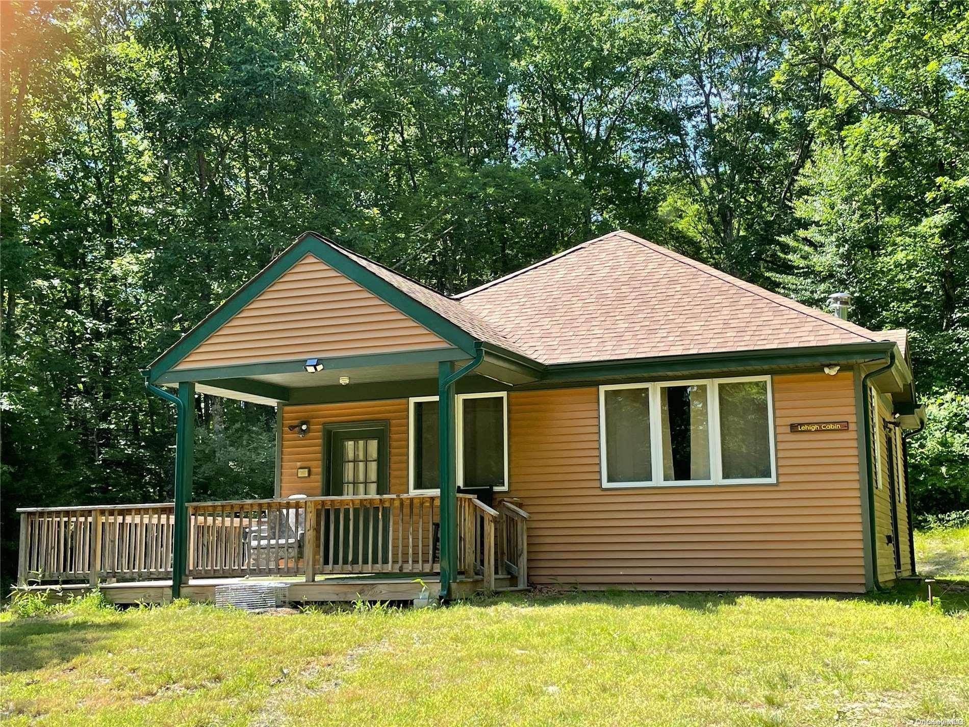 127 Kirkwood Road Stroudsburg, PA 18360 - Photo 7 of 20 a front view of a house with a garden
