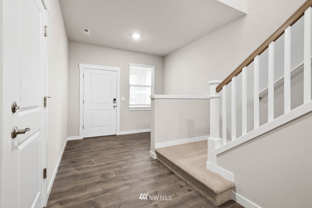 9 180th Place Southeast, Unit 39 Bothell, WA 98012 - Photo 4 of 31 a view of an entryway with wooden floor