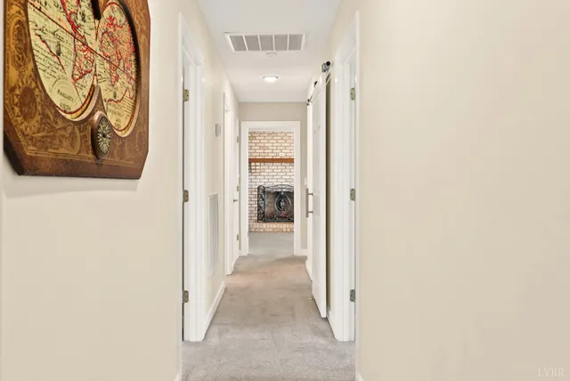 a spacious bathroom with a double vanity sink a mirror a bathtub and next to a window