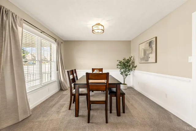 a large kitchen with stainless steel appliances granite countertop wooden cabinets a sink and a stove