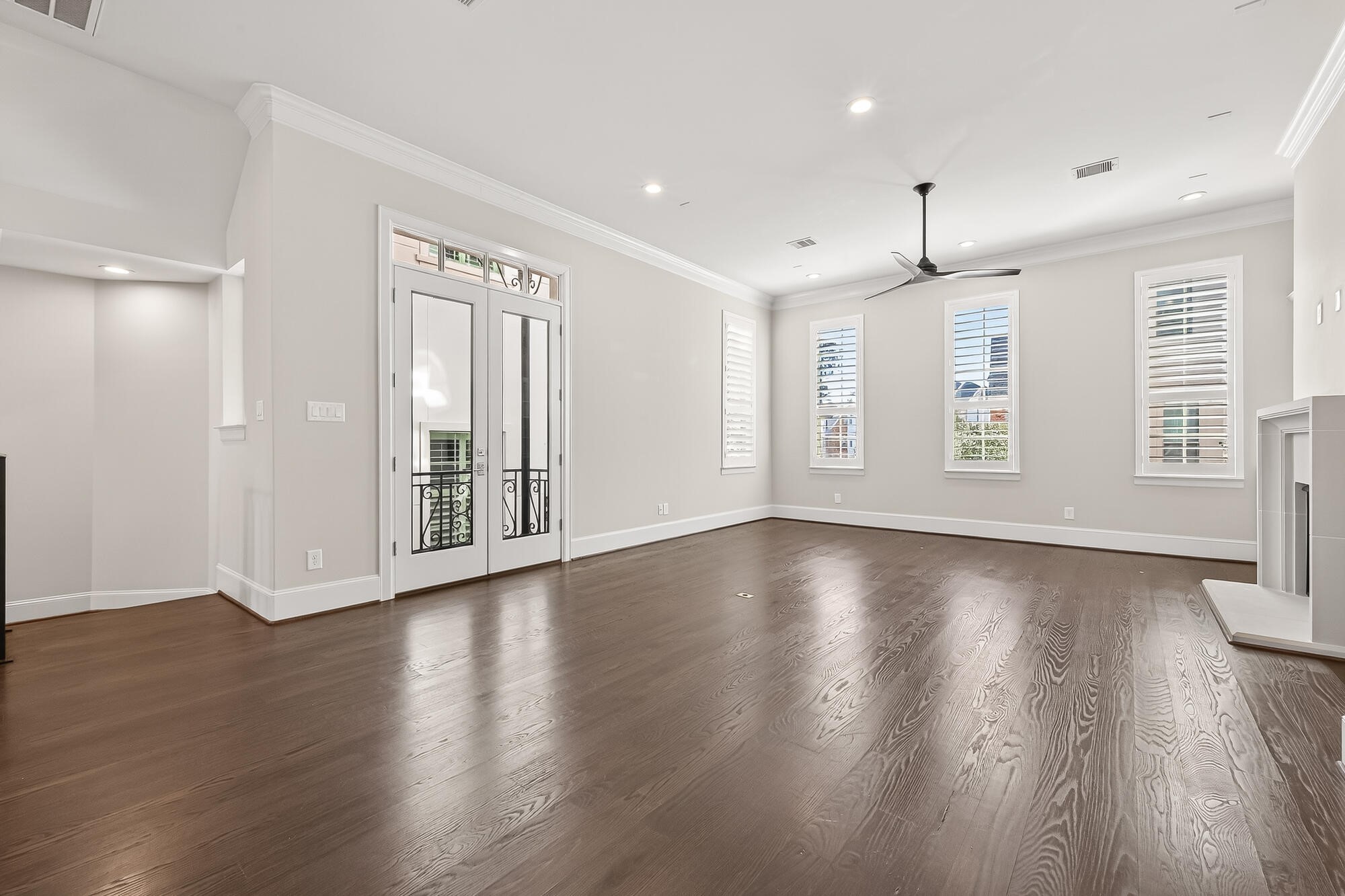 122 Gateway Park Place Spring, TX 77380 - Photo 16 of 44 a view of an empty room with wooden floor and a window
