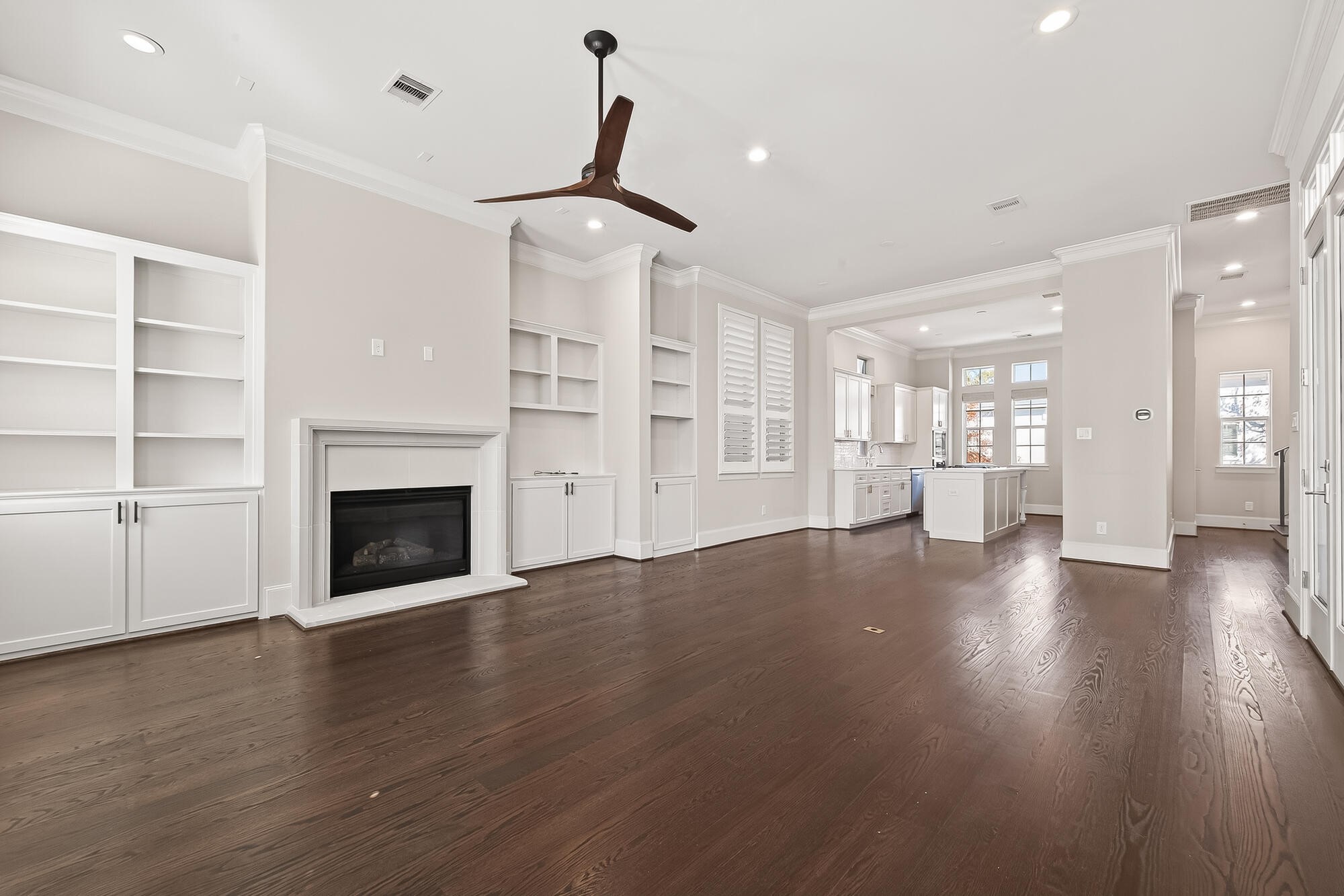 122 Gateway Park Place Spring, TX 77380 - Photo 18 of 44 a view of a livingroom with wooden floor a fireplace and window