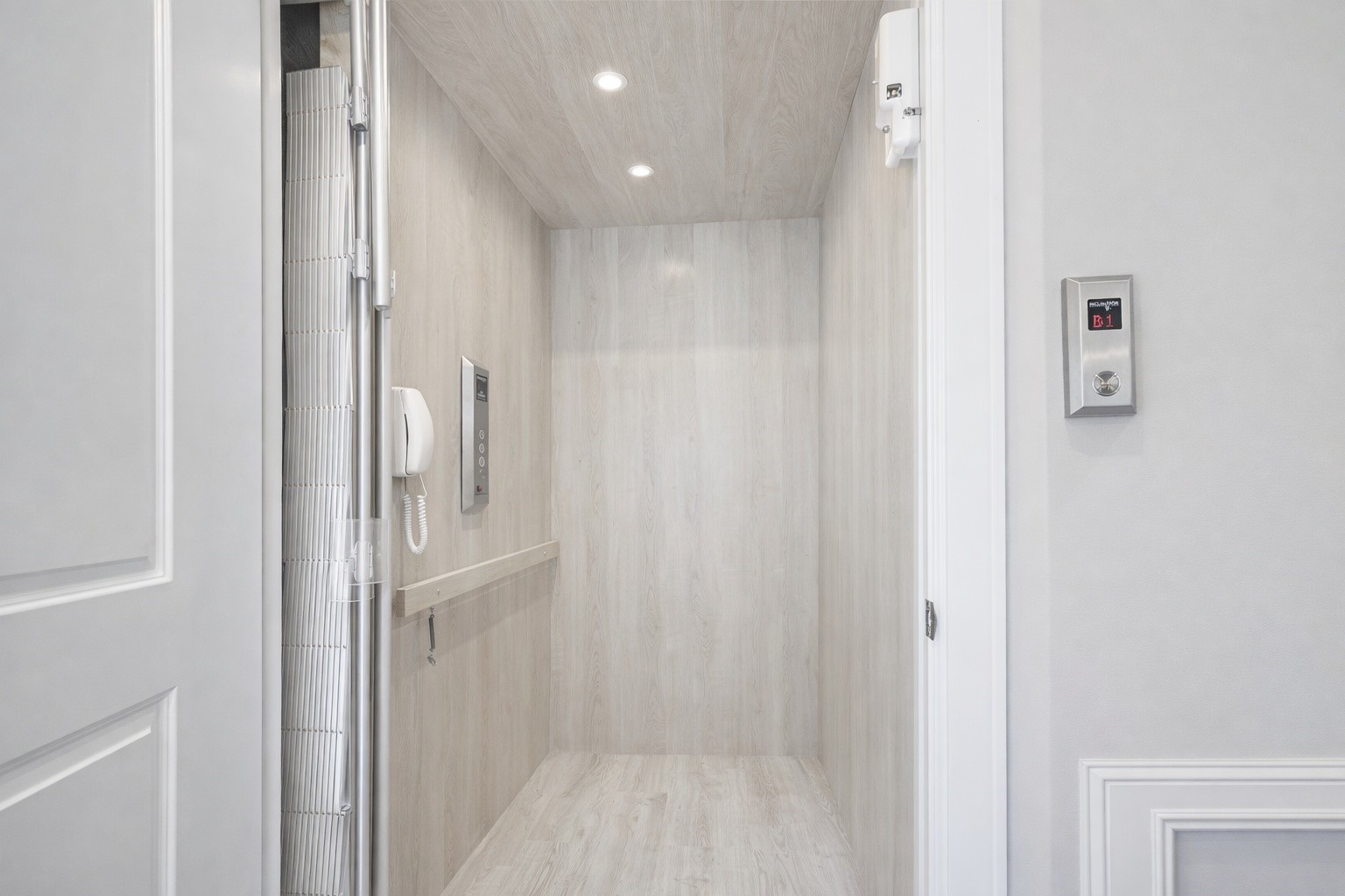 122 Gateway Park Place Spring, TX 77380 - Photo 8 of 44 Private in-home elevator with wood-paneled cab, recessed lighting, and smooth access between levels.