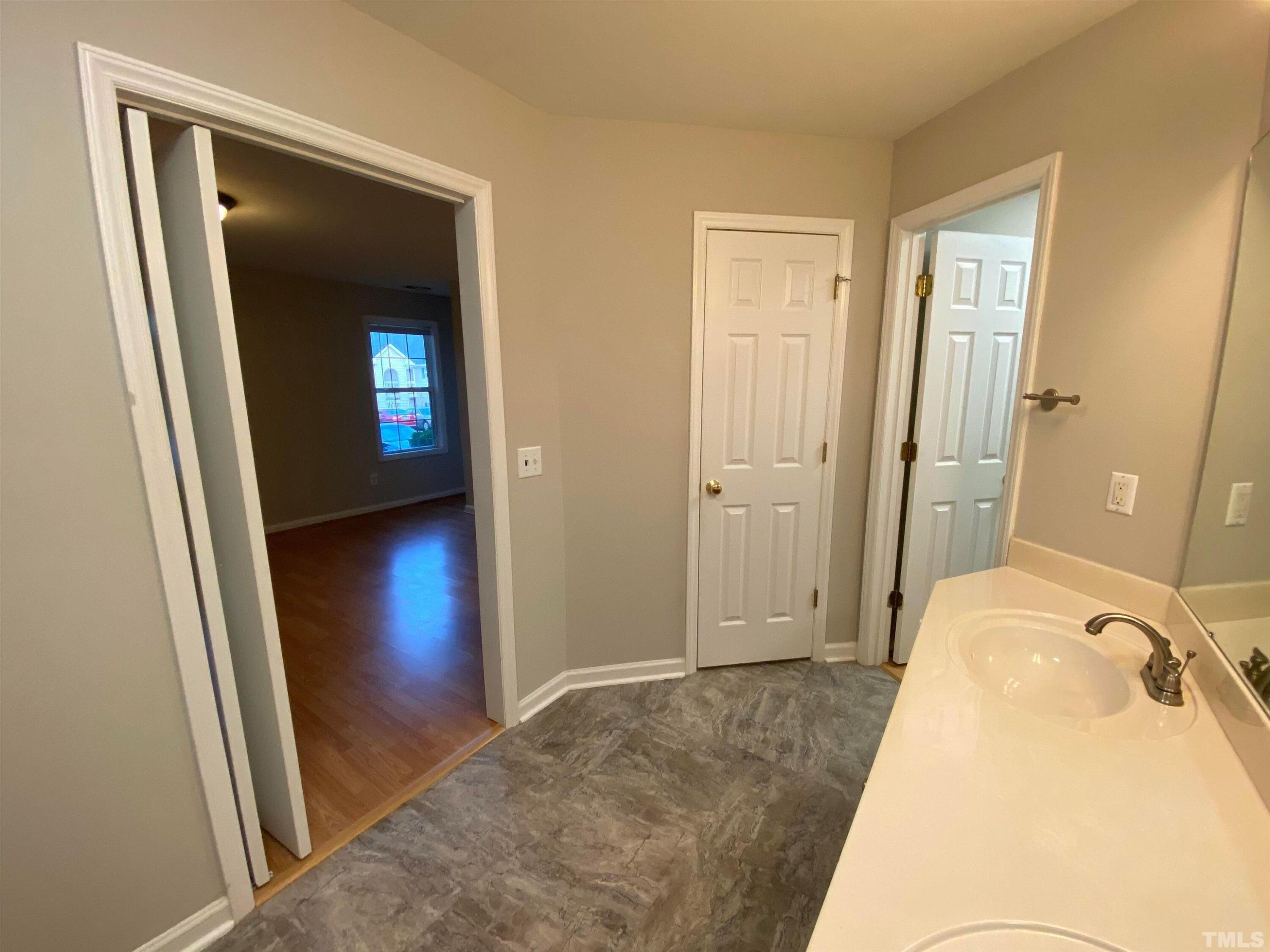 2413 Wellington Ridge Loop, Unit 2413 Cary, NC 27518 - Photo 24 of 30 a view of a bedroom from a hallway