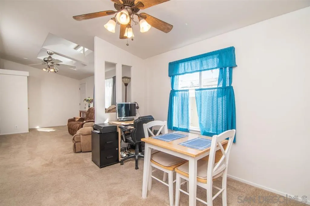 1810 Hillsdale Road, Unit 85 El Cajon, CA 92019 - Photo 9 of 23 a view of a dining room with furniture and chandelier