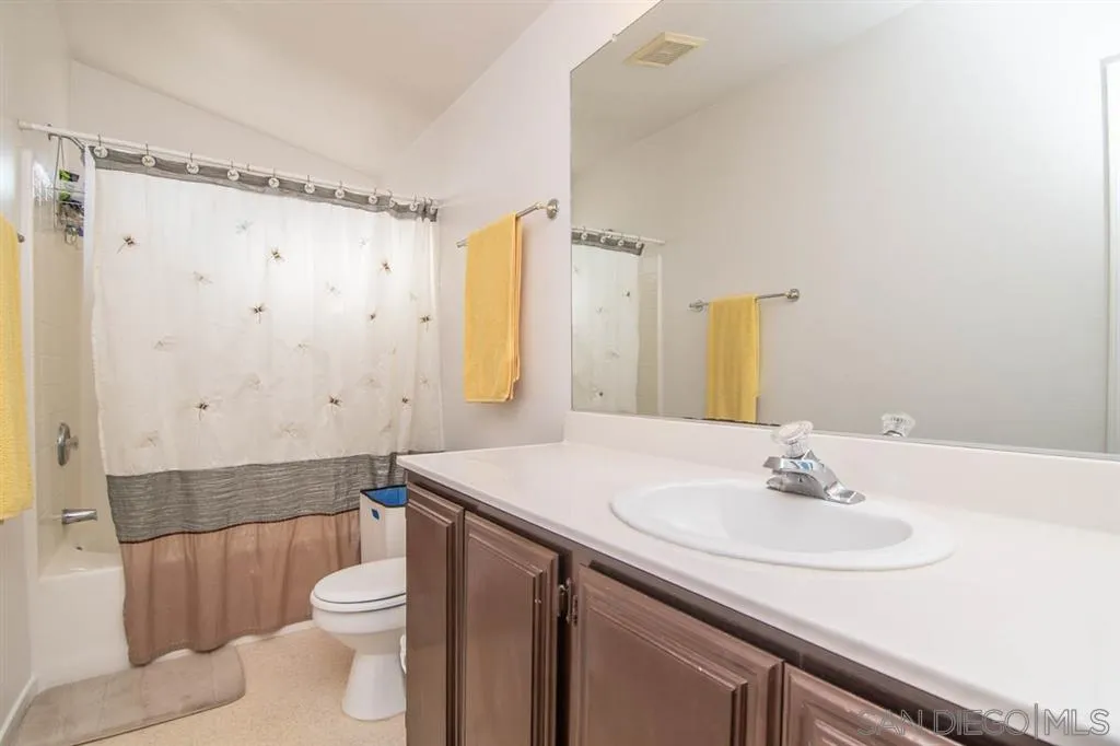 1810 Hillsdale Road, Unit 85 El Cajon, CA 92019 - Photo 10 of 23 a bathroom with a sink a toilet and shower