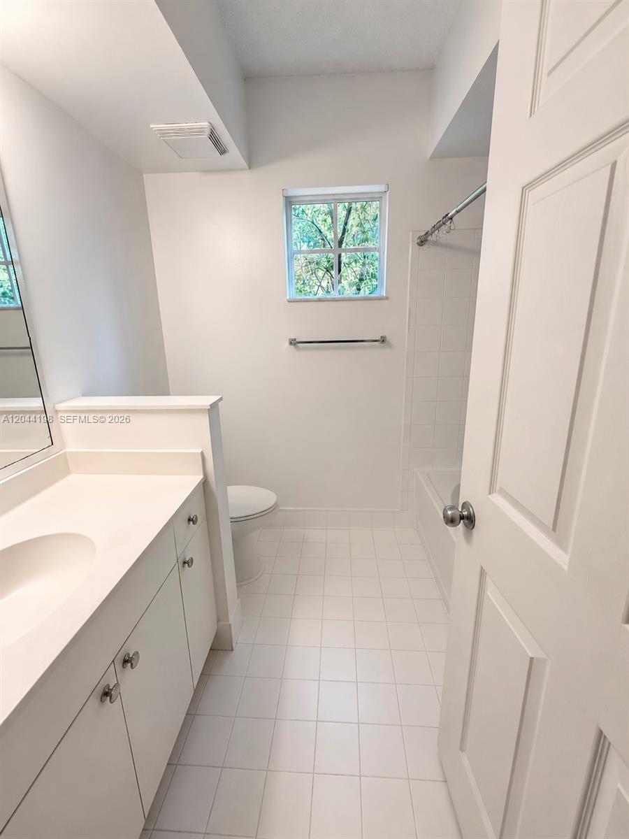 17145 North Bay Road, Unit 4307 Sunny Isles Beach, FL 33160 - Photo 17 of 35 a bathroom with a sink a toilet and shower