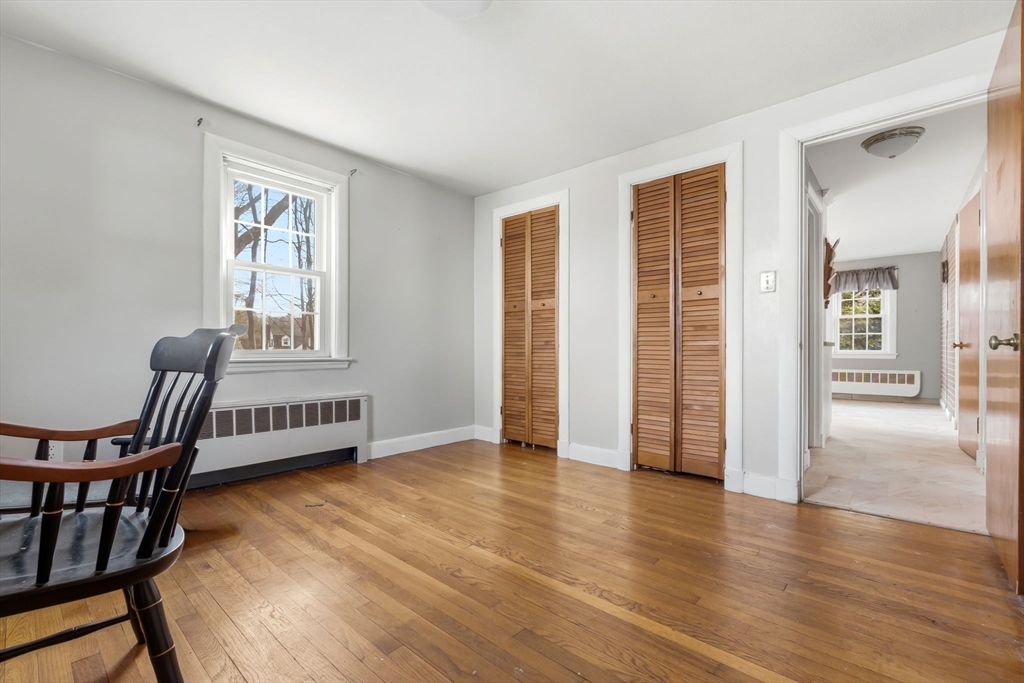 287 Main Street Saugus, MA 01906 - Photo 15 of 24 a view of an empty room with glass door and furniture