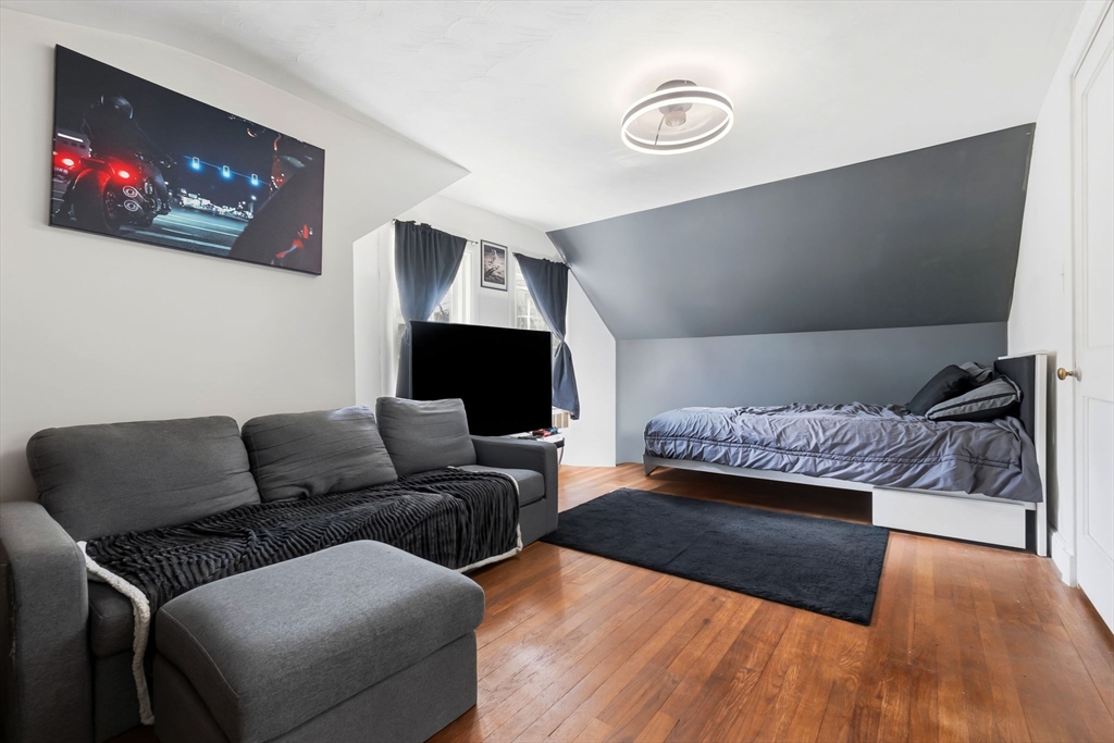 287 Main Street Saugus, MA 01906 - Photo 17 of 24 a living room with furniture and a flat screen tv