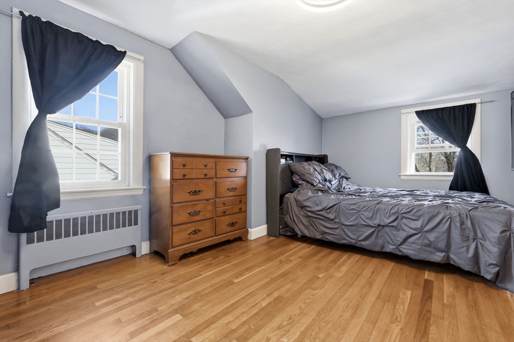 287 Main Street Saugus, MA 01906 - Photo 19 of 24 a bedroom with a bed and a window