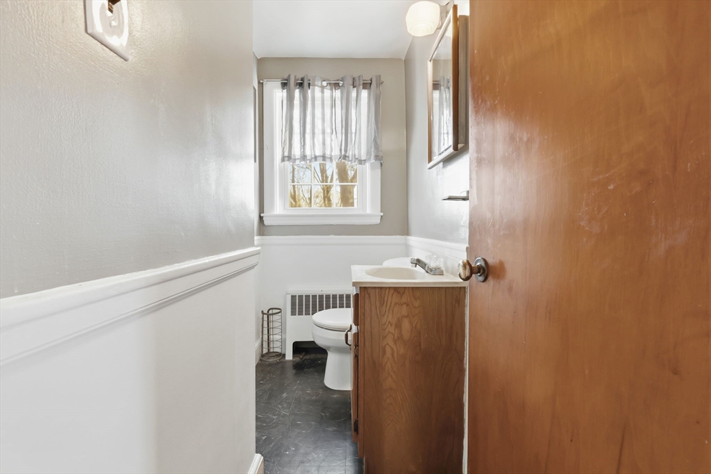 287 Main Street Saugus, MA 01906 - Photo 22 of 24 a view of a room that has a window and chair
