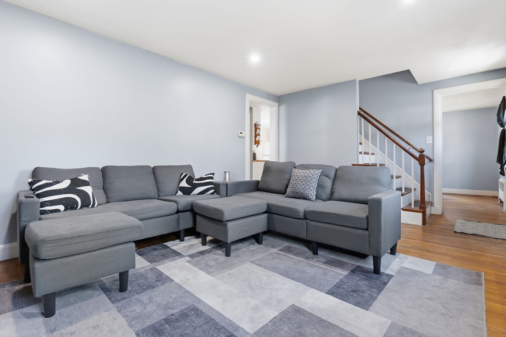 287 Main Street Saugus, MA 01906 - Photo 9 of 24 a living room with a couch and a coffee table with wooden floor