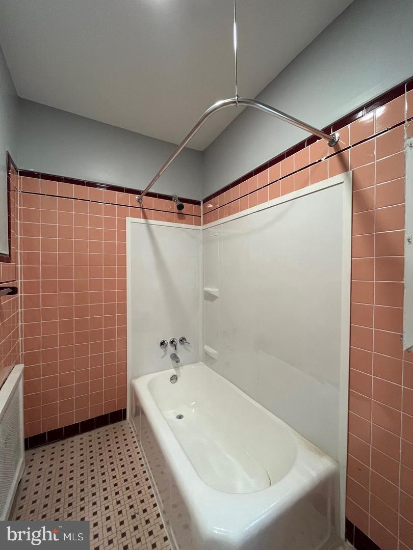 1208 Mifflin Street, Unit 2 Philadelphia, PA 19148 - Photo 8 of 11 a bathroom with a bathtub and a shower