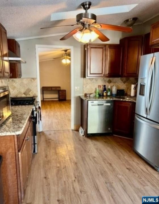 600 Pulis Mahwah, NJ 07430 - Photo 3 of 11 a kitchen with stainless steel appliances granite countertop a refrigerator a stove a sink and a microwave
