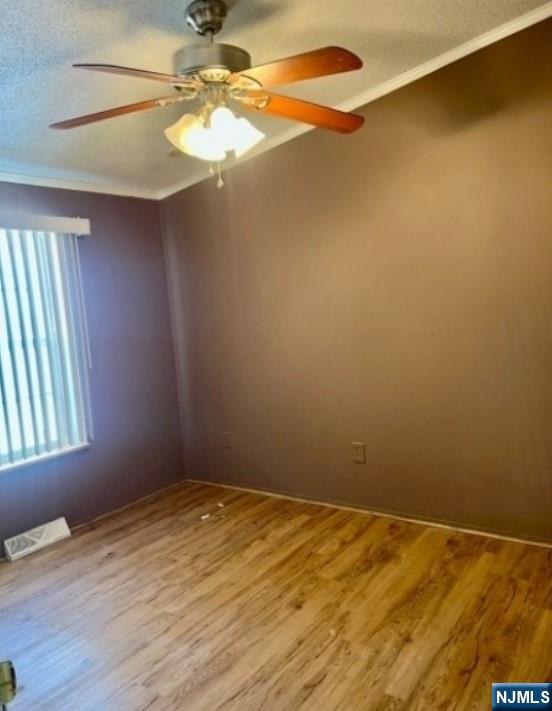 600 Pulis Mahwah, NJ 07430 - Photo 9 of 11 a view of empty room with window and wooden floor