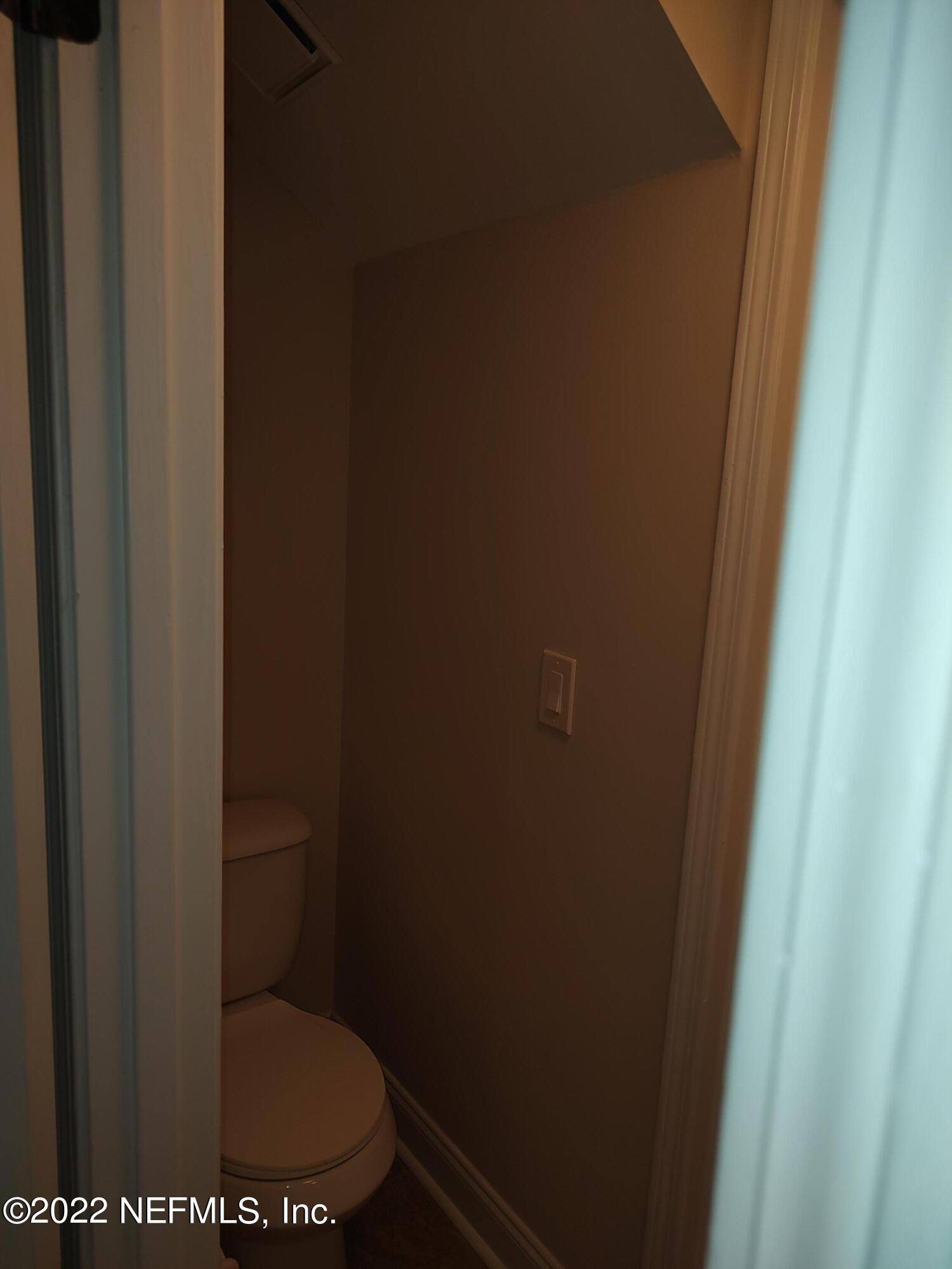 3517 Peeler Road, Unit 13 Jacksonville, FL 32277 - Photo 13 of 31 a bathroom with a toilet
