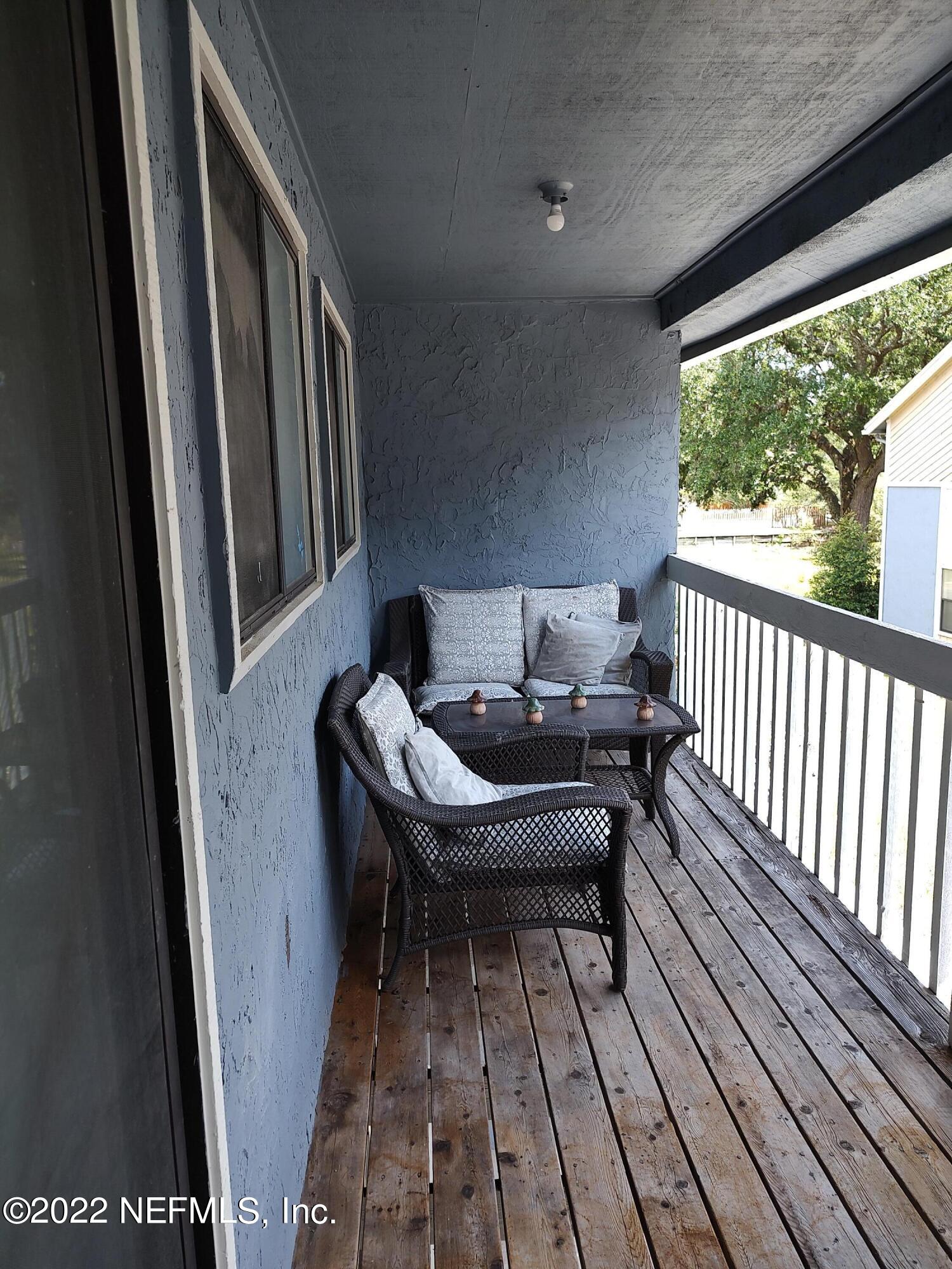 3517 Peeler Road, Unit 13 Jacksonville, FL 32277 - Photo 25 of 31 a view of a balcony with furniture