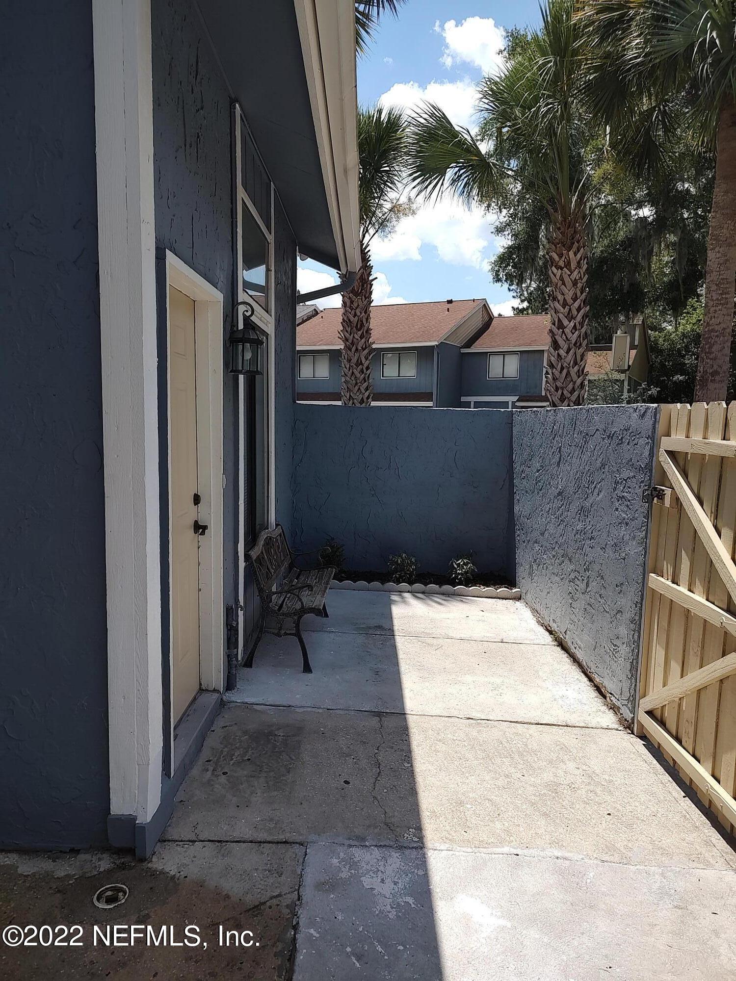 3517 Peeler Road, Unit 13 Jacksonville, FL 32277 - Photo 4 of 31 a view of a backyard