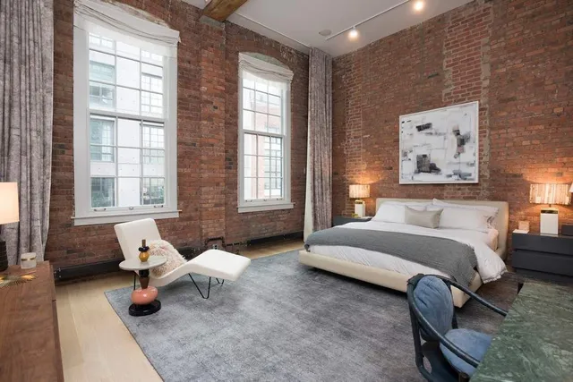 a dining room with furniture and a chandelier
