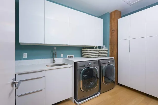 a bathroom with a sink mirror and vanity