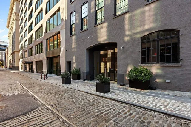 a view of a hallway with a couch