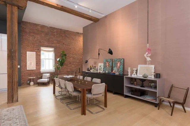 a kitchen with a dining table and chairs