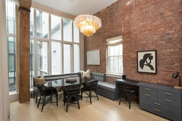 a kitchen with a table and chairs
