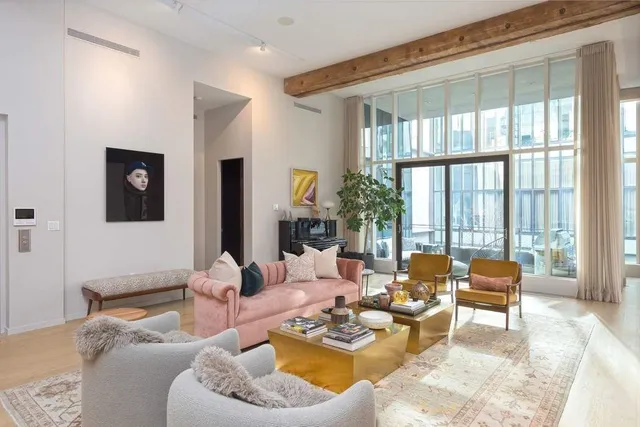 a view of a livingroom with furniture and window