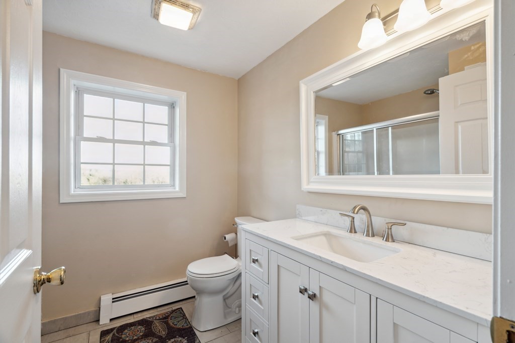 33 Sibley Road Winchendon, MA 01475 - Photo 13 of 17 a bathroom with a sink toilet vanity and window