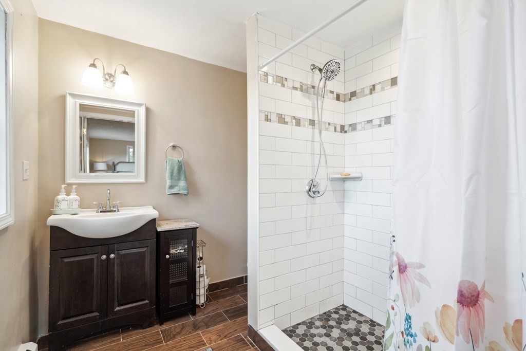 33 Sibley Road Winchendon, MA 01475 - Photo 15 of 17 a bathroom with a sink a mirror and shower