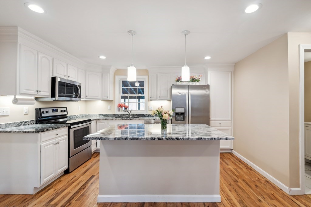 33 Sibley Road Winchendon, MA 01475 - Photo 5 of 17 a kitchen with kitchen island granite countertop a sink appliances cabinets and a counter top space