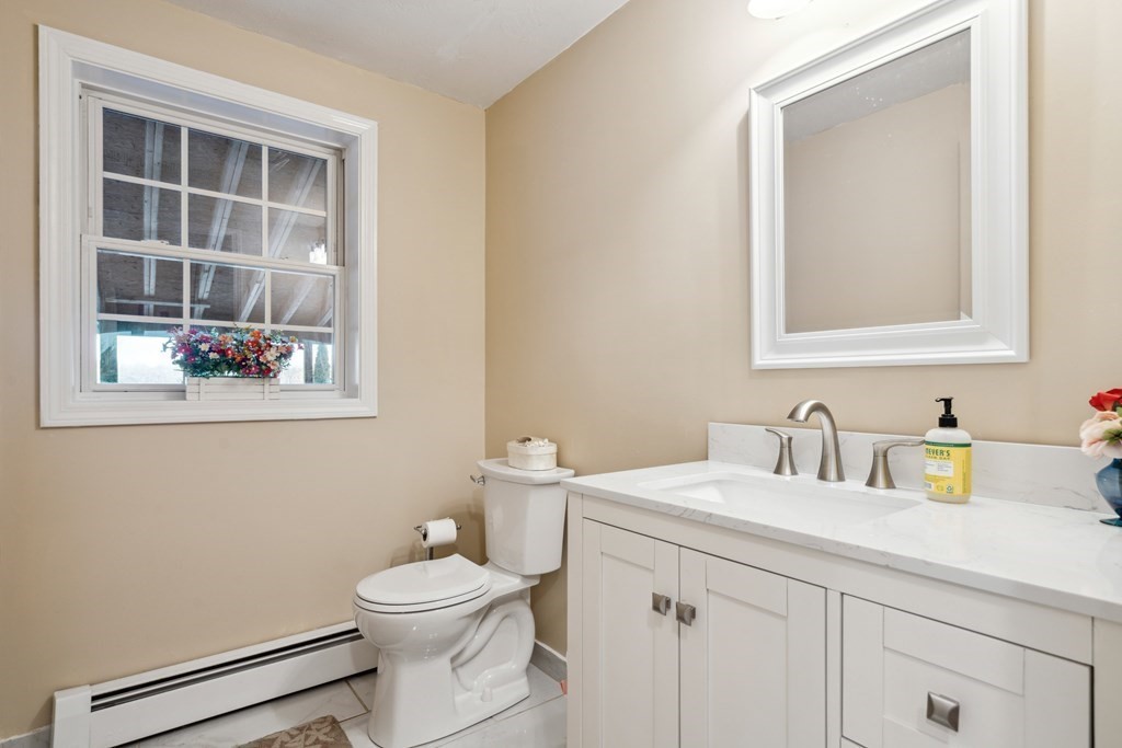 33 Sibley Road Winchendon, MA 01475 - Photo 8 of 17 a bathroom with a toilet a sink a vanity and mirror
