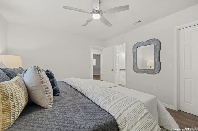 a bedroom with bed and a window