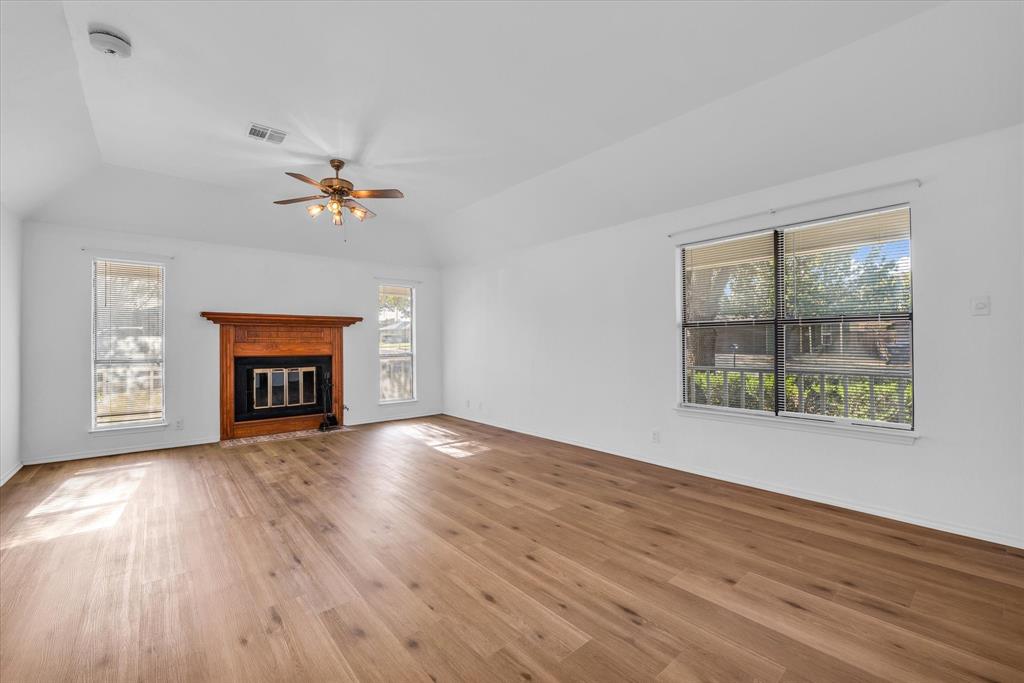 1300 Chapel Downs Waco, TX 76712 - Photo 12 of 38 a view of an empty room with a window and wooden floor
