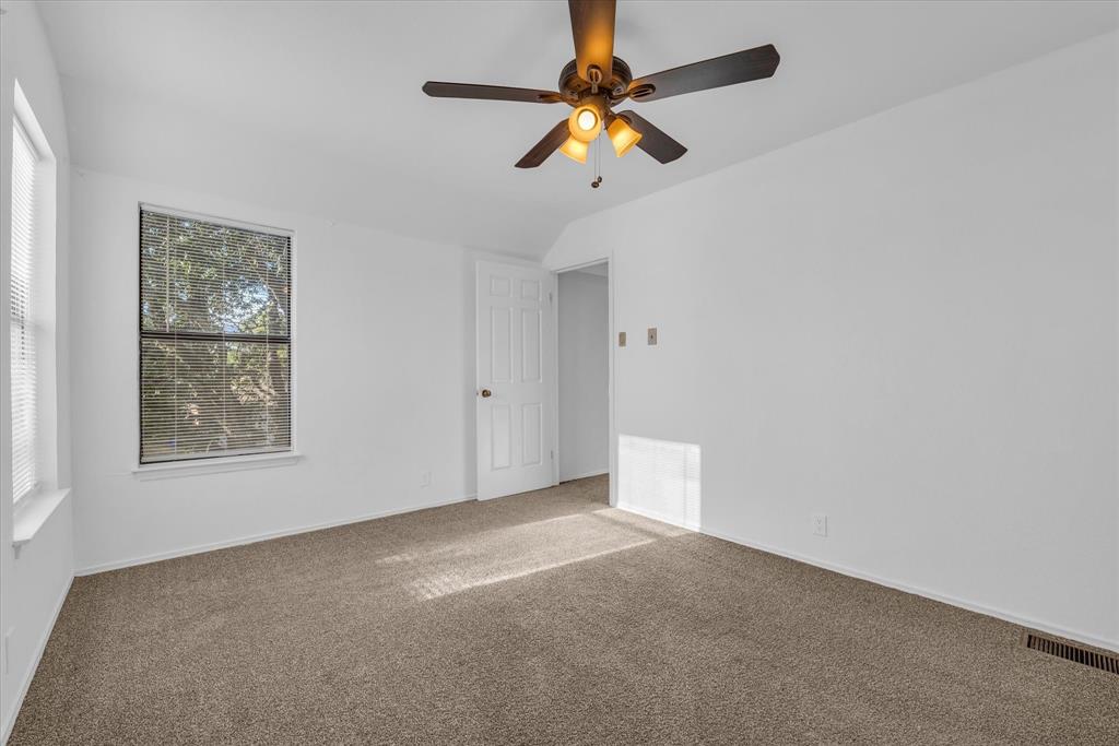1300 Chapel Downs Waco, TX 76712 - Photo 15 of 38 an empty room with a window and a fan