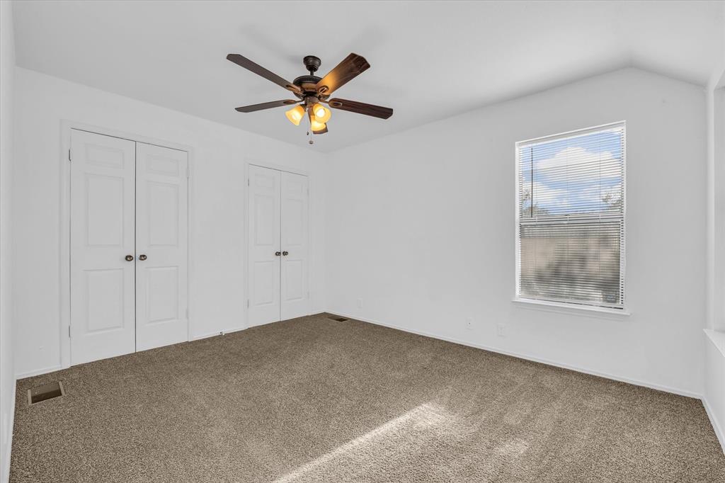 1300 Chapel Downs Waco, TX 76712 - Photo 16 of 38 a view of a big room with wooden floor closet and windows