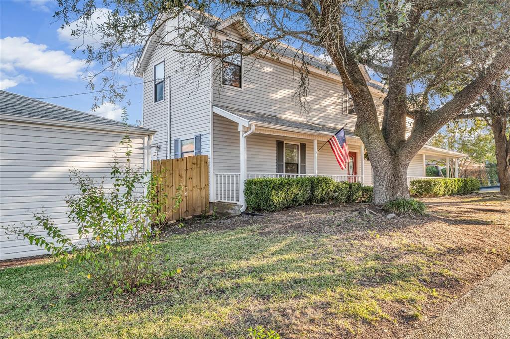 1300 Chapel Downs Waco, TX 76712 - Photo 2 of 38 a view of a house with a small yard and tree s