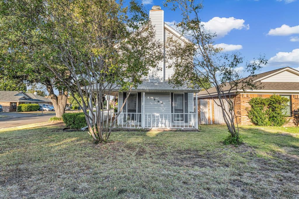 1300 Chapel Downs Waco, TX 76712 - Photo 31 of 38 a front view of a house with garden