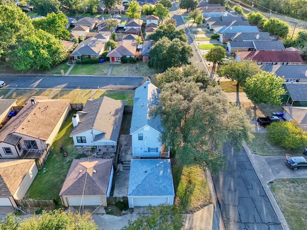 1300 Chapel Downs Waco, TX 76712 - Photo 37 of 38 an aerial view of a house with a garden and lake view