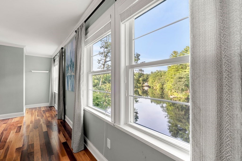 22 Fosters Pond Road Andover, MA 01810 - Photo 22 of 42 a view of a room with wooden floor and windows
